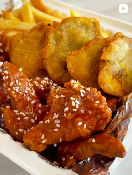 Chicken wings with fries and fried plantain